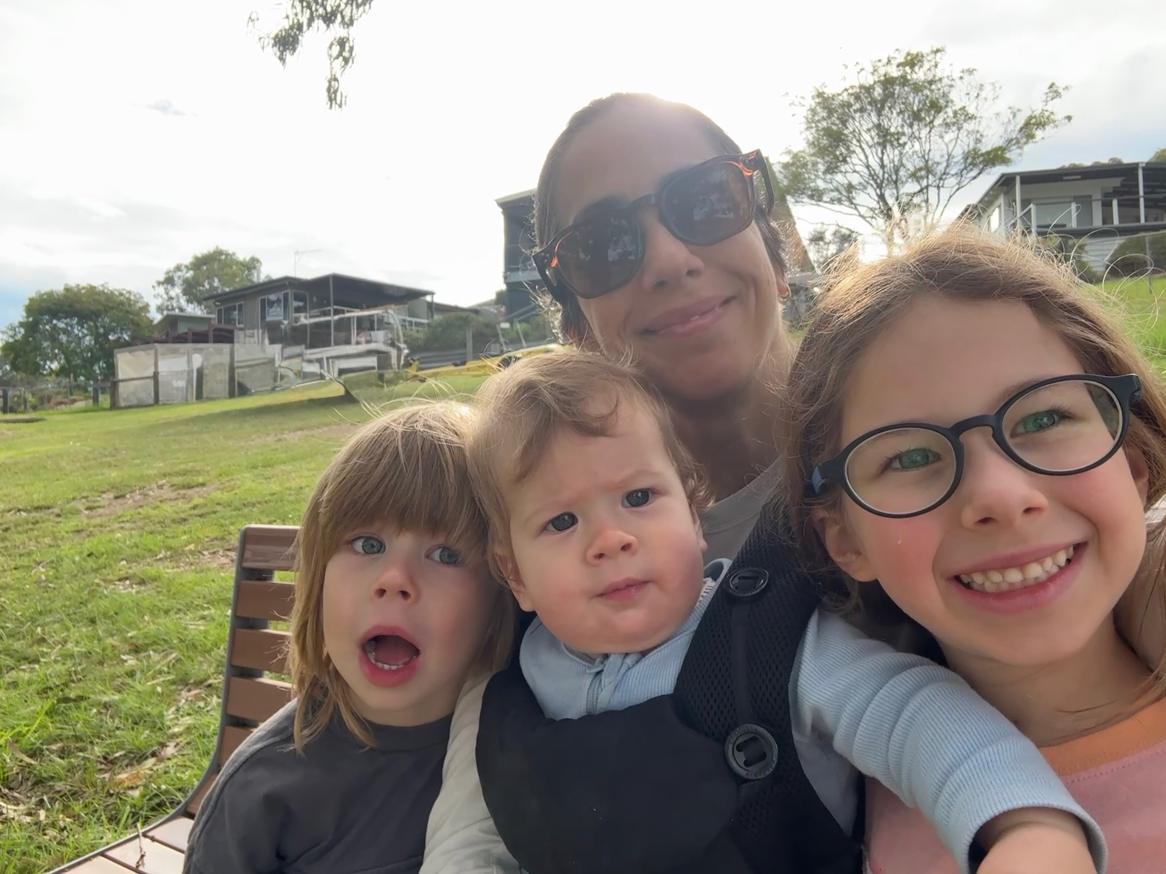 Founder with her three children at the beach